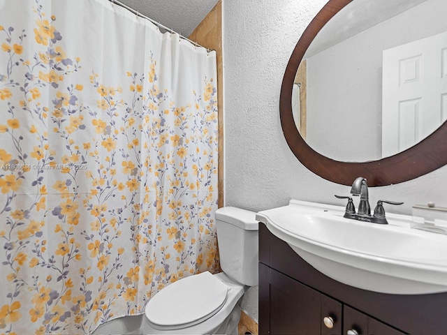12749 SW 71st Ter, Miami, FL 33183 - bathroom featuring a textured wall, vanity, toilet, a shower with curtain, and a textured ceiling