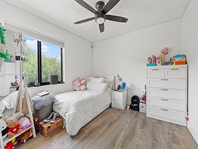 12749 SW 71st Ter, Miami, FL 33183 - bedroom with light wood-type flooring, ceiling fan, and a textured ceiling