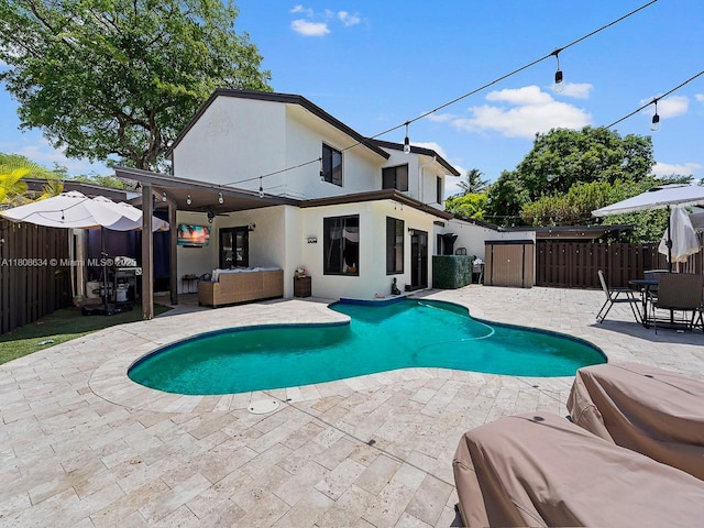 12749 SW 71st Ter, Miami, FL 33183 - view of swimming pool with a patio, a fenced backyard, an outdoor hangout area, and a ceiling fan