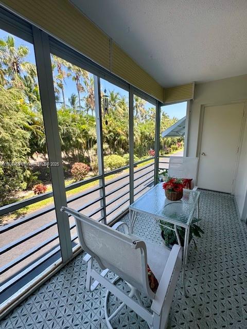 700 NE 14th Ave Unit 204, Hallandale Beach, FL 33009 - sunroom featuring healthy amount of natural light