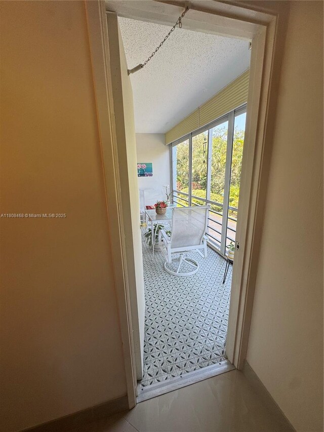 700 NE 14th Ave Unit 204, Hallandale Beach, FL 33009 - entryway featuring a textured ceiling