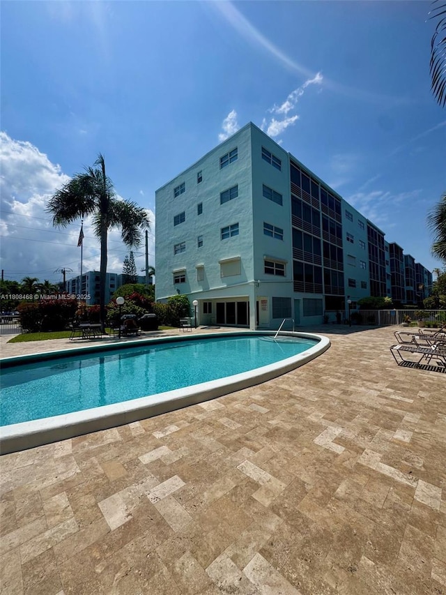 700 NE 14th Ave Unit 204, Hallandale Beach, FL 33009 - community pool featuring a patio area