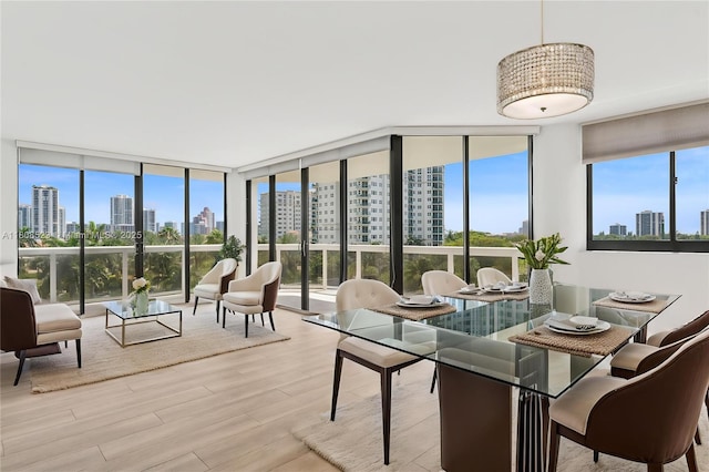 20185 E Country Club Dr Unit 505, Aventura, FL 33180 - dining area with a skyline view, wood finished floors, and expansive windows
