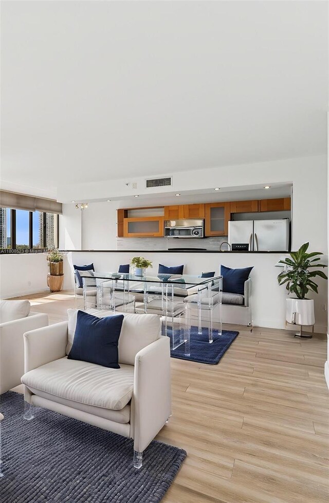 20185 E Country Club Dr Unit 505, Aventura, FL 33180 - living room featuring light wood-style floors and recessed lighting