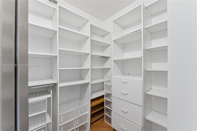 20185 E Country Club Dr Unit 505, Aventura, FL 33180 - spacious closet featuring wood finished floors