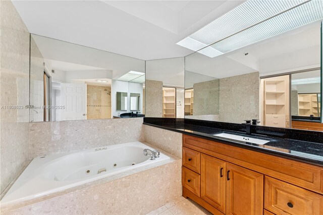20185 E Country Club Dr Unit 505, Aventura, FL 33180 - bathroom featuring a whirlpool tub, tile patterned flooring, and vanity