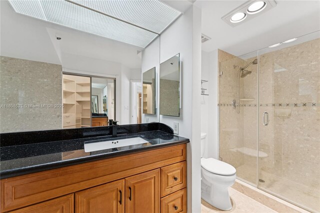 20185 E Country Club Dr Unit 505, Aventura, FL 33180 - bathroom featuring toilet, a shower stall, and vanity