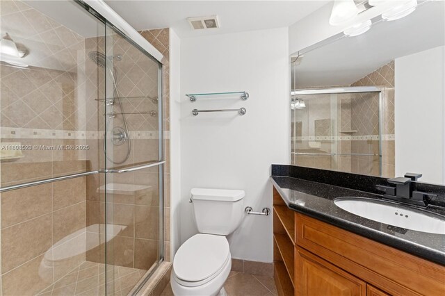 20185 E Country Club Dr Unit 505, Aventura, FL 33180 - full bath with tile patterned flooring, vanity, toilet, and a shower stall