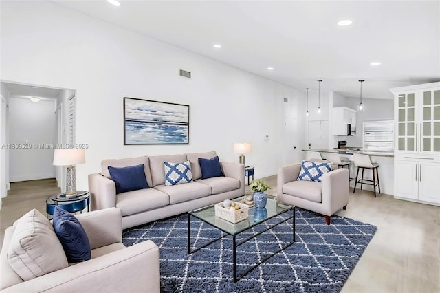 8886 Windtree St, Boca Raton, FL 33496 - living room featuring light wood-type flooring and recessed lighting