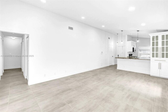 8886 Windtree St, Boca Raton, FL 33496 - unfurnished living room featuring recessed lighting