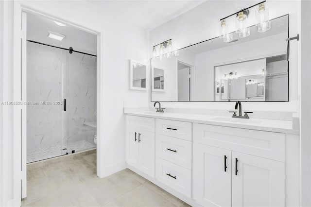 8886 Windtree St, Boca Raton, FL 33496 - bathroom with a marble finish shower, double vanity, toilet, baseboards, and tile patterned flooring