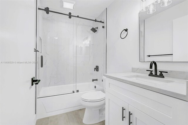 8886 Windtree St, Boca Raton, FL 33496 - bathroom featuring vanity, toilet, and combined bath / shower with glass door
