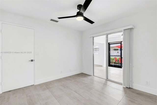 8886 Windtree St, Boca Raton, FL 33496 - empty room featuring ceiling fan, light tile patterned flooring, and baseboards