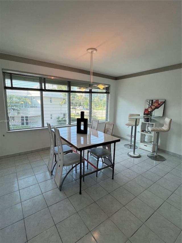 10178 Collins Ave Unit 210, Bal Harbour, FL 33154 - dining space with light tile patterned floors and ornamental molding