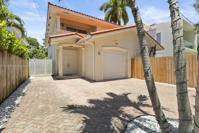 2922 Catalina St Unit 2922, Miami, FL 33133 - view of front of property with a tile roof, stucco siding, and a garage