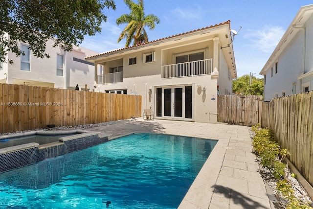 2922 Catalina St Unit 2922, Miami, FL 33133 - view of swimming pool featuring a fenced backyard, french doors, a patio, and a pool with connected hot tub