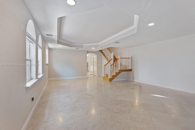 2922 Catalina St Unit 2922, Miami, FL 33133 - empty room featuring arched walkways, stairway, a raised ceiling, baseboards, and recessed lighting