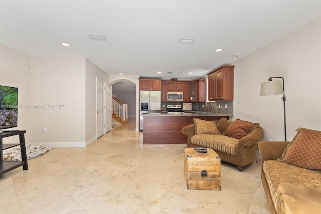 2922 Catalina St Unit 2922, Miami, FL 33133 - living room with arched walkways, recessed lighting, healthy amount of natural light, baseboards, and stairs