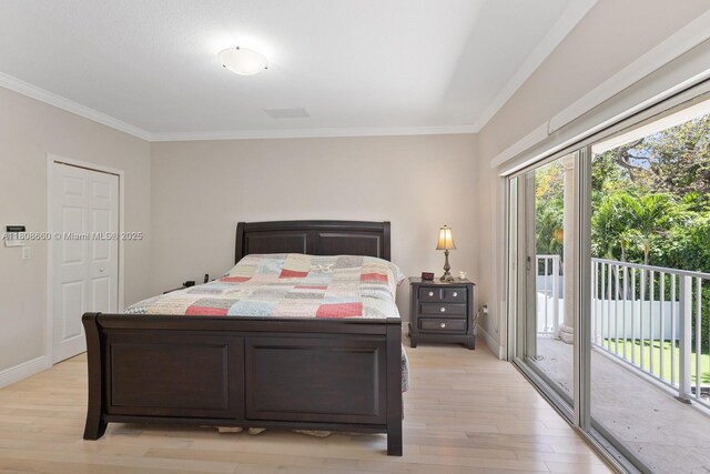2922 Catalina St Unit 2922, Miami, FL 33133 - bedroom with access to exterior, light wood-type flooring, crown molding, and baseboards