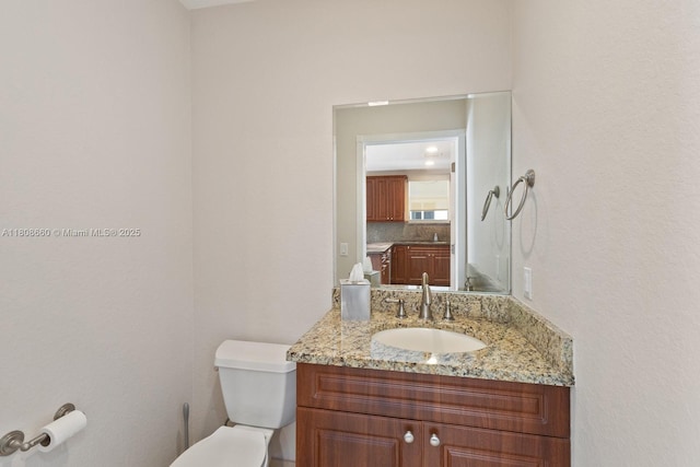 2922 Catalina St Unit 2922, Miami, FL 33133 - half bath featuring toilet, vanity, and decorative backsplash