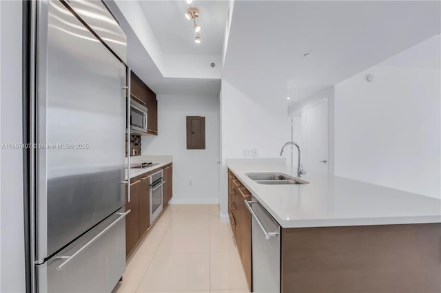 500 Brickell Ave Unit 3103, Miami, FL 33131 - kitchen featuring stainless steel appliances, modern cabinets, a sink, electric panel, and light countertops