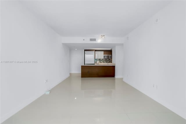 500 Brickell Ave Unit 3103, Miami, FL 33131 - unfurnished living room featuring light tile patterned floors