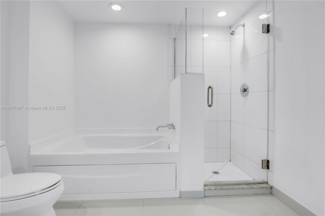 500 Brickell Ave Unit 3103, Miami, FL 33131 - bathroom with toilet, a garden tub, a stall shower, recessed lighting, and tile patterned flooring