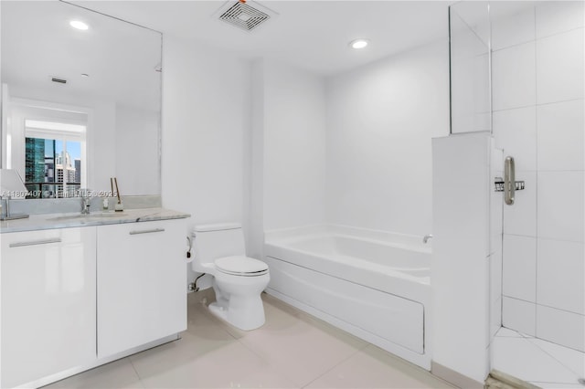 500 Brickell Ave Unit 3103, Miami, FL 33131 - bathroom featuring toilet, vanity, a bath, recessed lighting, and tile patterned flooring