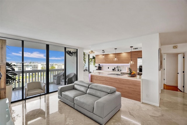1000 W Island Blvd Unit 611, Aventura, FL 33160 - living room with expansive windows and light tile patterned floors