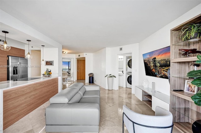 1000 W Island Blvd Unit 611, Aventura, FL 33160 - living area featuring stacked washer / drying machine and light tile patterned floors