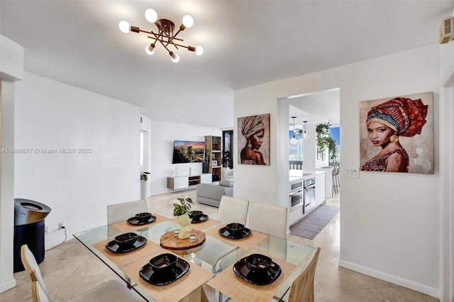 1000 W Island Blvd Unit 611, Aventura, FL 33160 - tiled dining room featuring a chandelier