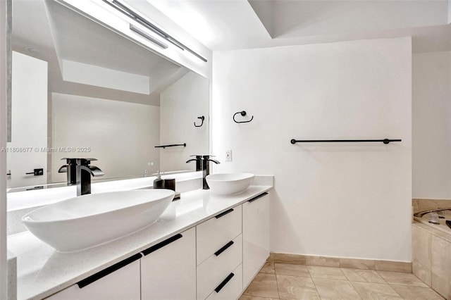 1000 W Island Blvd Unit 611, Aventura, FL 33160 - bathroom featuring baseboards, double vanity, and a bath