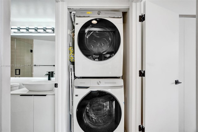 1000 W Island Blvd Unit 611, Aventura, FL 33160 - laundry room featuring stacked washer and clothes dryer