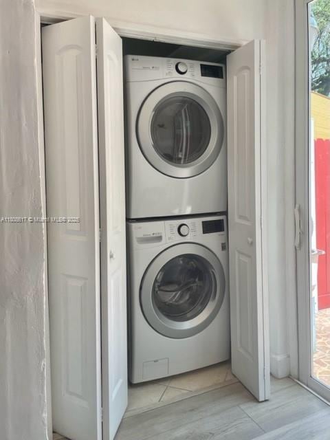 200 NW 107th Ave Unit 106, Miami, FL 33172 - washroom with stacked washer and clothes dryer