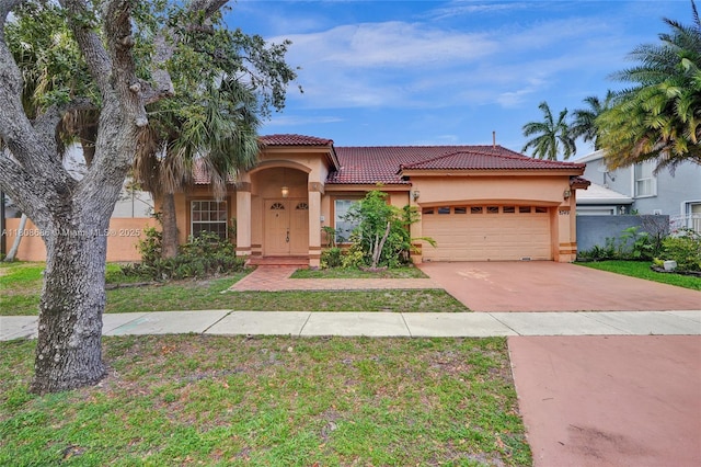 8749 NW 189th Ter, Hialeah, FL 33018 - mediterranean / spanish home with stucco siding, a tiled roof, a garage, driveway, and a front lawn