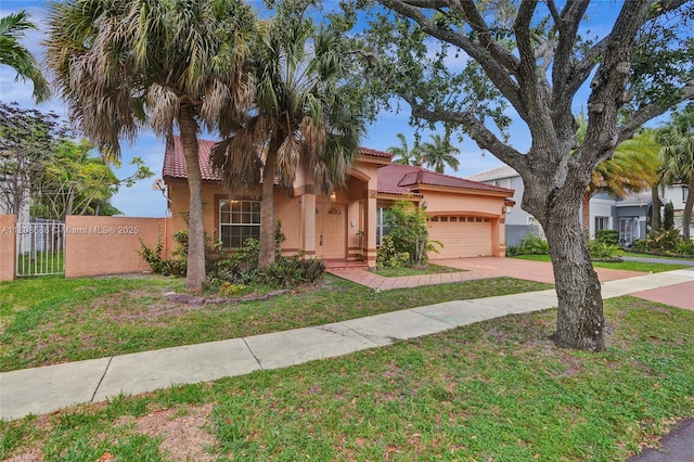 8749 NW 189th Ter, Hialeah, FL 33018 - mediterranean / spanish home with stucco siding, a tiled roof, concrete driveway, and an attached garage