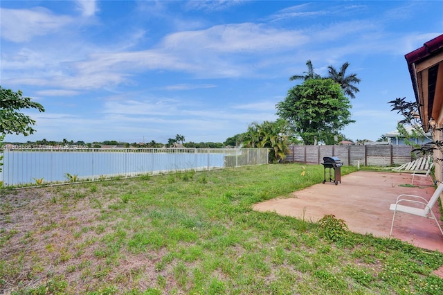 8749 NW 189th Ter, Hialeah, FL 33018 - view of yard featuring a patio and a water view