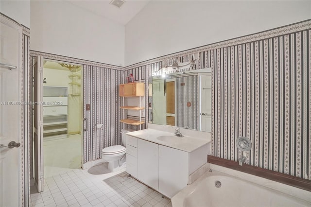 8749 NW 189th Ter, Hialeah, FL 33018 - bathroom featuring tile patterned flooring, vanity, a bath, and toilet