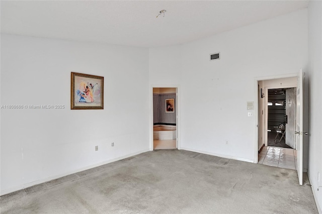 8749 NW 189th Ter, Hialeah, FL 33018 - carpeted empty room featuring baseboards and a high ceiling