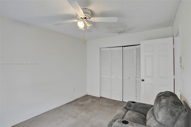 8749 NW 189th Ter, Hialeah, FL 33018 - living area with carpet flooring, a textured ceiling, ceiling fan, and baseboards
