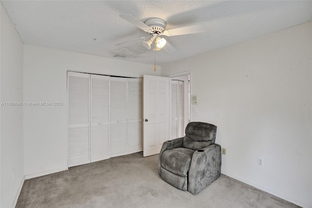 8749 NW 189th Ter, Hialeah, FL 33018 - sitting room with carpet flooring, ceiling fan, baseboards, and a textured ceiling