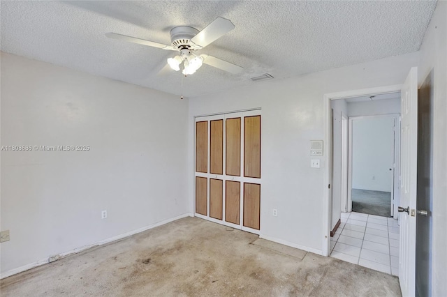 8749 NW 189th Ter, Hialeah, FL 33018 - unfurnished bedroom featuring a textured ceiling, carpet, baseboards, and ceiling fan