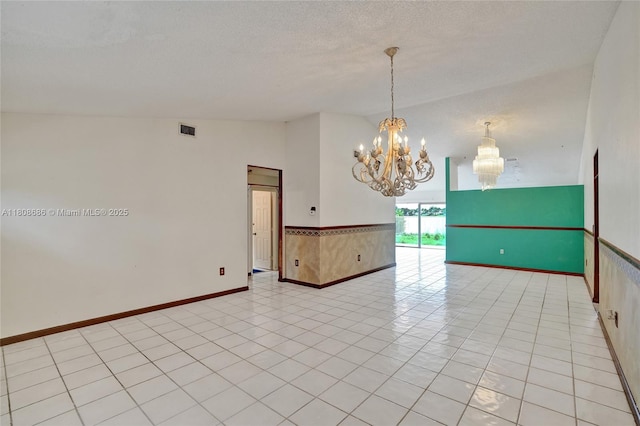 8749 NW 189th Ter, Hialeah, FL 33018 - empty room with a chandelier, baseboards, vaulted ceiling, and a textured ceiling