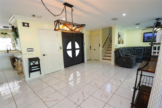 16401 SW 141st Ave, Miami, FL 33177 - entryway with crown molding, stairway, recessed lighting, and light marble finish floors