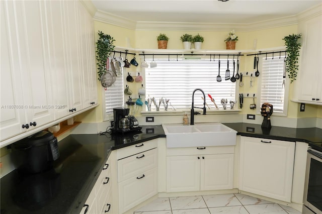 16401 SW 141st Ave, Miami, FL 33177 - kitchen featuring a sink, light marble finish flooring, dark countertops, crown molding, and white cabinets