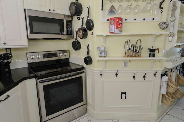 16401 SW 141st Ave, Miami, FL 33177 - kitchen with appliances with stainless steel finishes, marble finish flooring, and white cabinetry