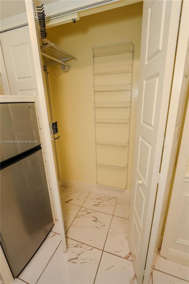 16401 SW 141st Ave, Miami, FL 33177 - walk in closet featuring light marble finish floors