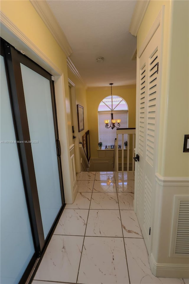16401 SW 141st Ave, Miami, FL 33177 - hall with marble finish floors, a chandelier, and crown molding