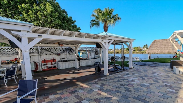 16401 SW 141st Ave, Miami, FL 33177 - view of patio / terrace with a pergola and a water view
