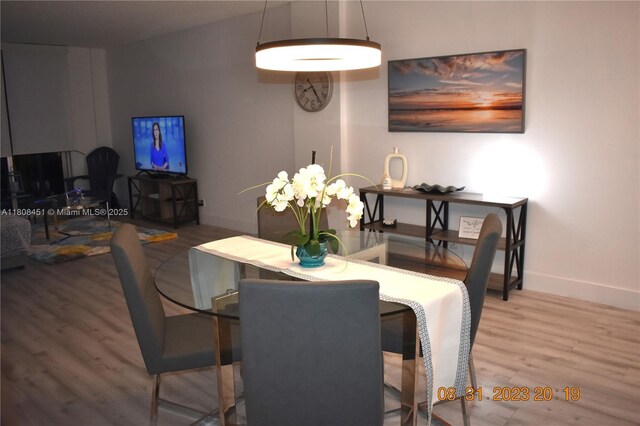 3901 S Ocean Dr Unit 11A, Hollywood, FL 33019 - dining room featuring wood finished floors and baseboards